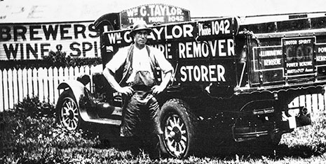 Black and white image of WG Taylor with his truck way back 1918.